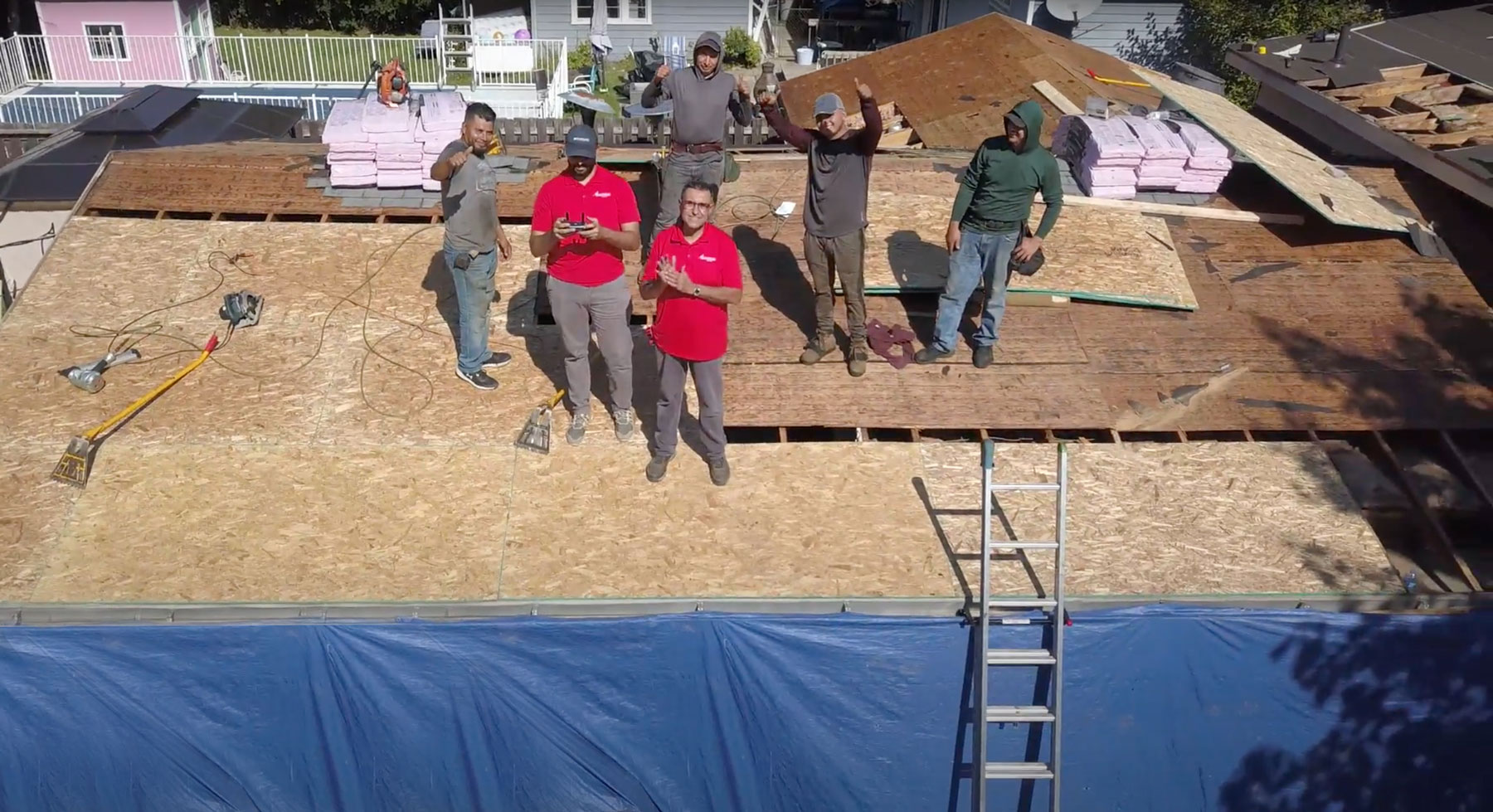 A.H. Construction crew on top of roof