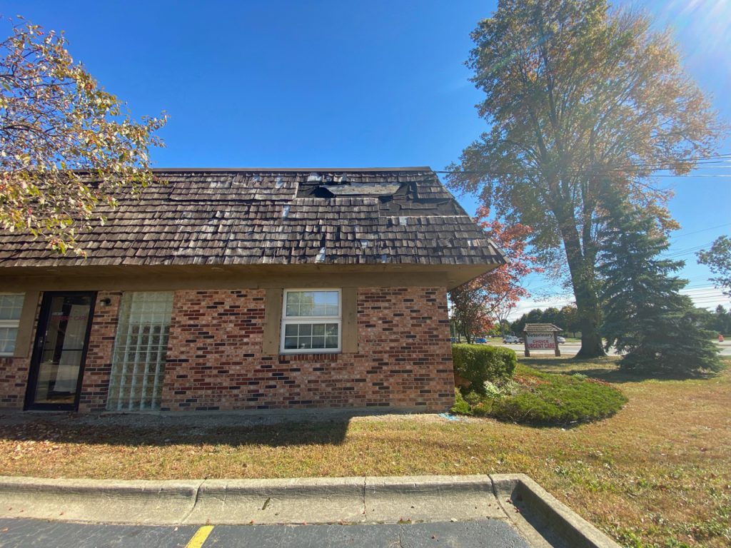 Damaged roof that needs roof replacement